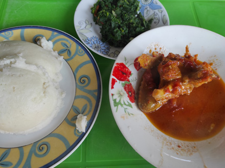 Chicken, pumpkin leaves and nshima