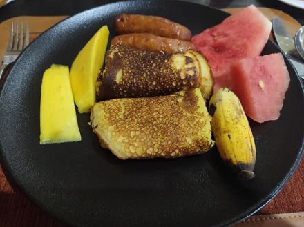 Breakfast: Pancakes, sausages and fresh fruit