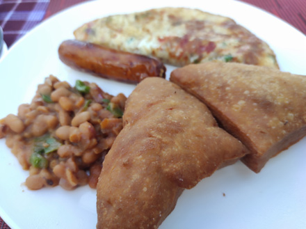 Mega breakfast with beans, sausage, omelette and donuts